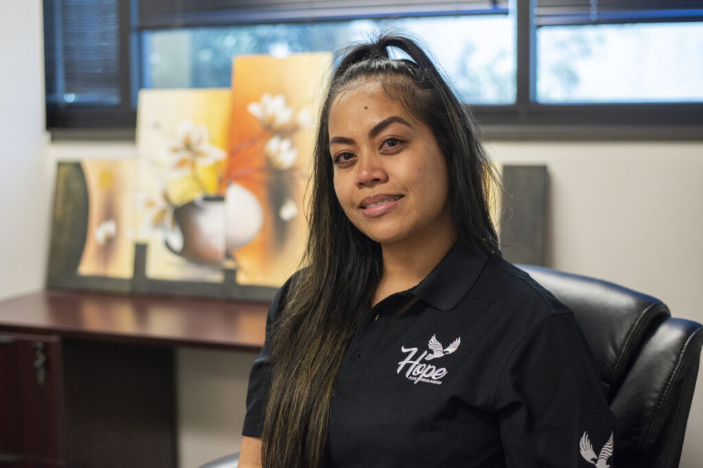Image description: Portrait of Geetha Green at her workplace. End of alt text. 