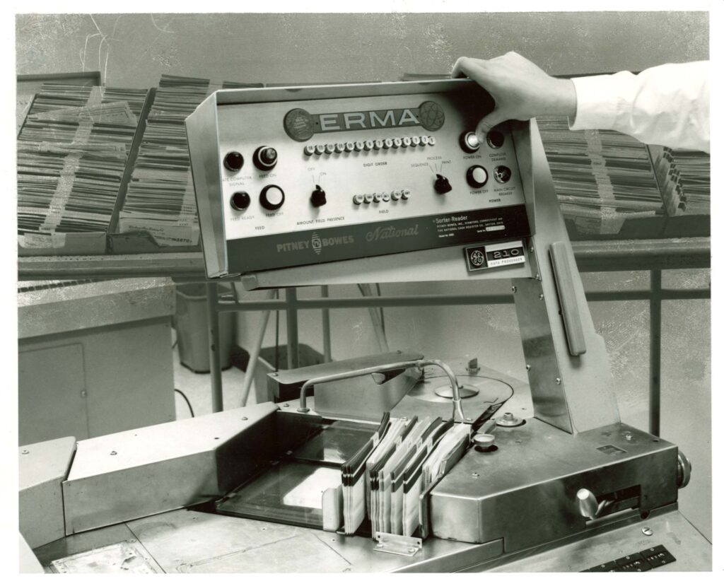 Image description: Closeup of the control panel of the ERMA check processing machine, 1959. End of alt text.