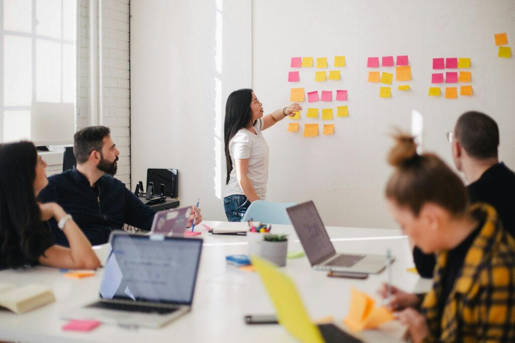 people in an office discussing payroll transformation